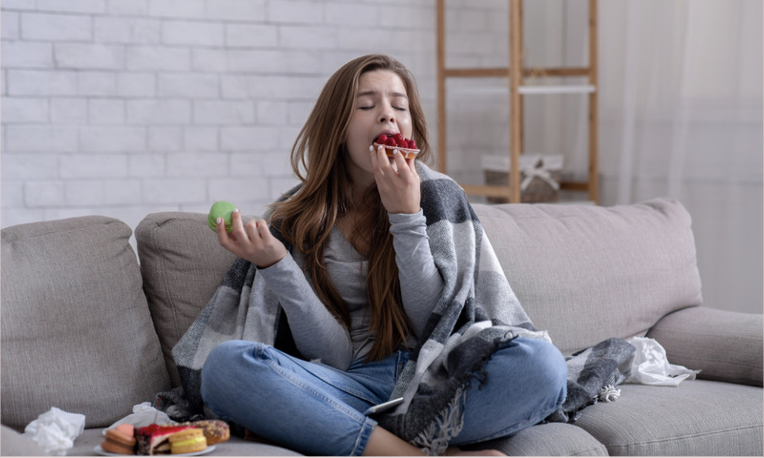 Woman indulging in the coping strategy of over eating