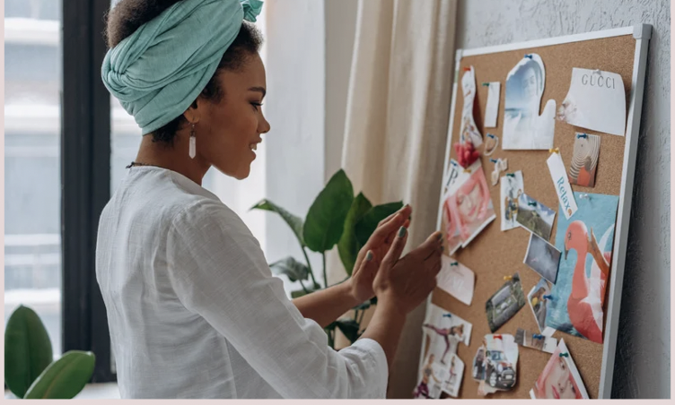 Woman creating a vision board